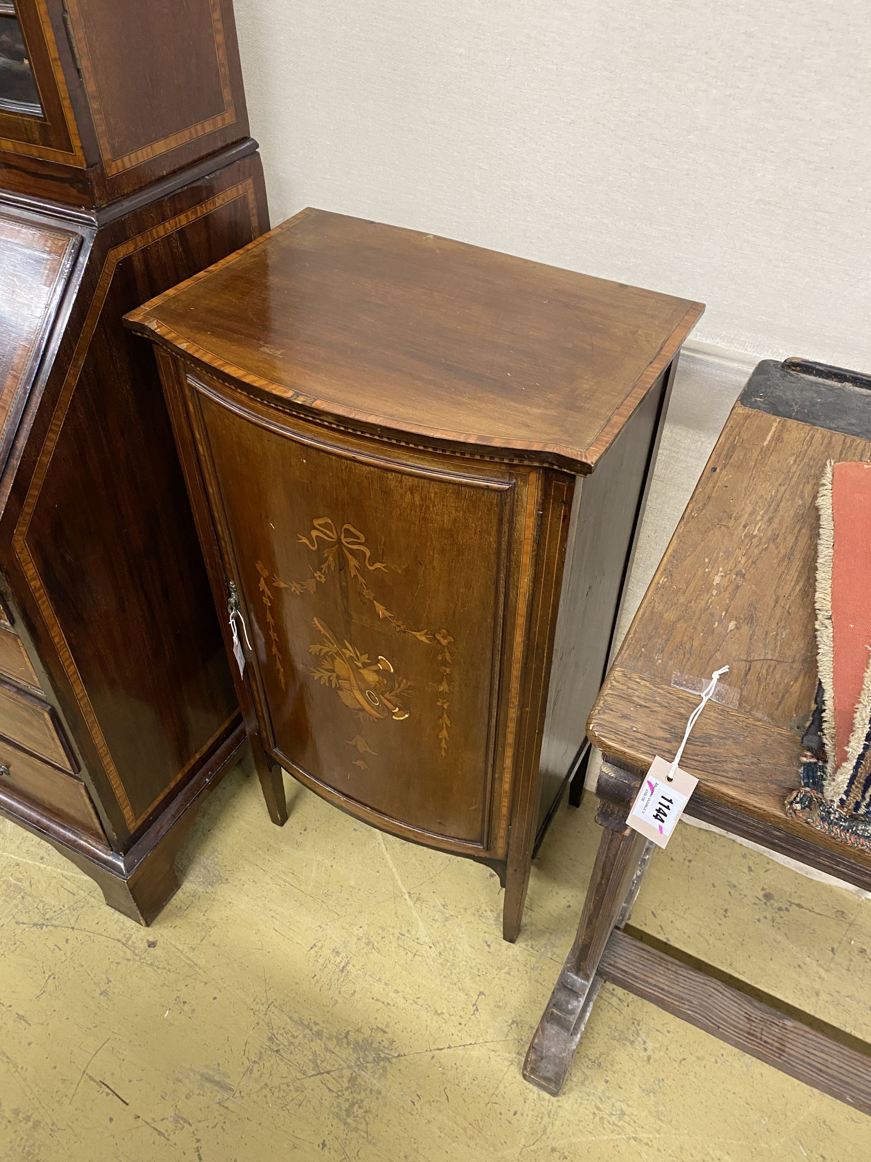 An Edwardian satinwood banded marquetry inlaid mahogany bow front side cabinet, width 53cm, depth 38cm, height 100cm